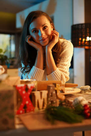 Charming brunette woman drinking an aromatic winter cup of the teaの写真素材