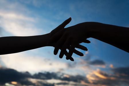 Conceptual image of female and male hands together の写真素材