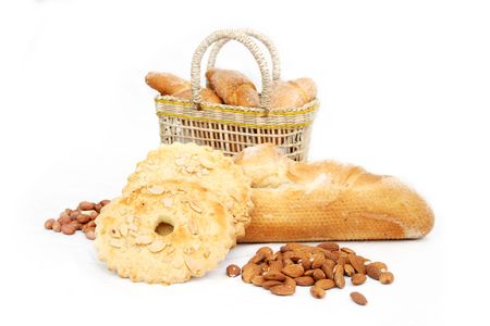 Basket of various fresh baked bread with nutsの写真素材