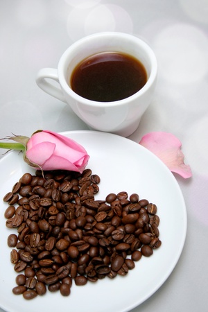 Cup of coffee with heart from coffee beansの写真素材