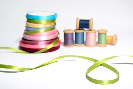 Isolated spools of colored threads with ribbonsの写真素材
