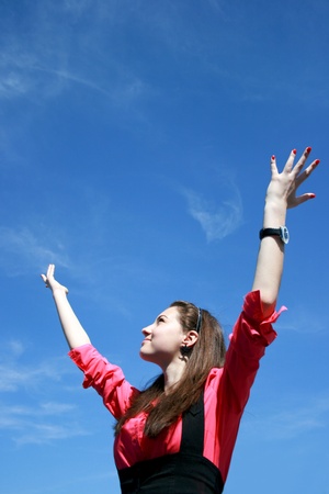 Young businesswoman with hands upの写真素材