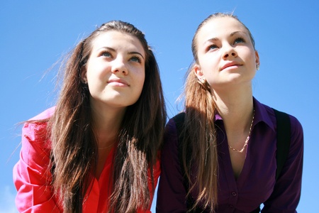 Two young women looking aheadの写真素材