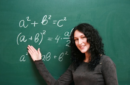 Smiling girl at the blackboard