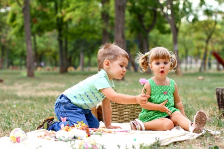 Caucasian little boy and girl in the parkの写真素材