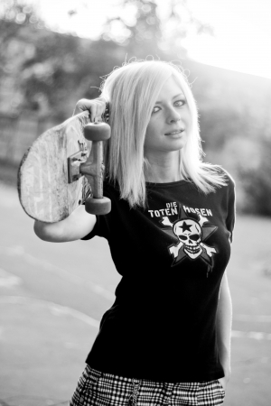 Young caucasian teen with skateの写真素材