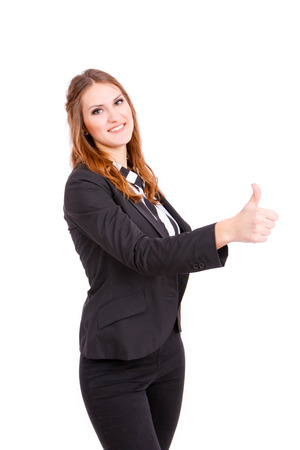 Young business woman making thumbs up isolatedの写真素材