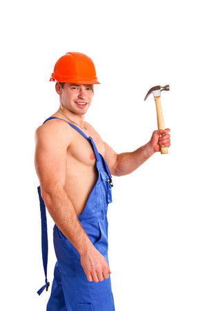 Portrait of sexy mechanic with a hammer isolatedの写真素材