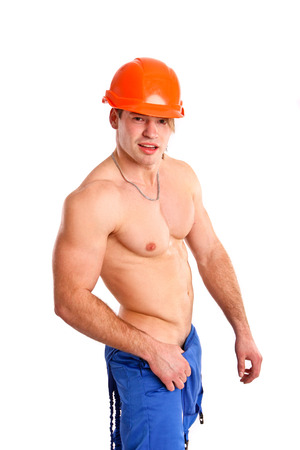 Sexy naked mechanic posing on  white backgroundの写真素材