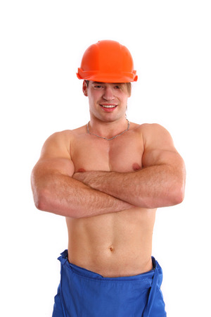 Sexy nude mechanic posing on a white background isolatedの写真素材