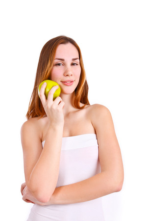 Attractive woman with apple isolatedの写真素材
