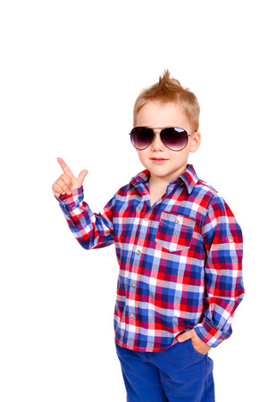 Cool little boy pointing his finger isolatedの写真素材