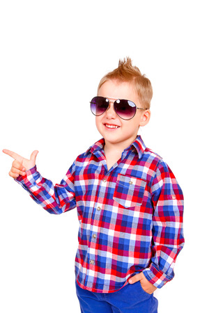 Cool little boy pointing his finger isolatedの写真素材