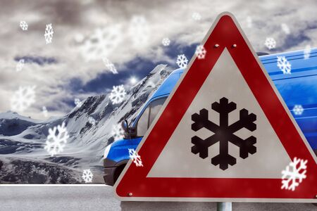 winter driving - warning sign - risk of snow and iceの写真素材