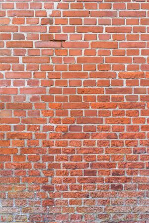 Red vintage brick wall texture, verticalの写真素材