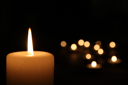 burning candle with tea lightsの写真素材