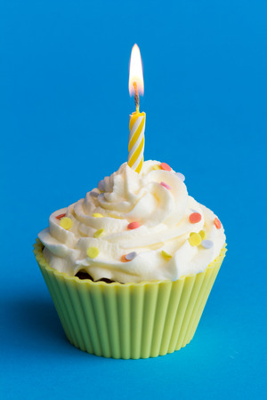 yellow birthday cupcakeの写真素材