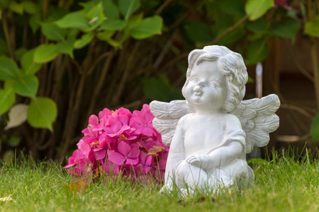 Angel figure with flowerの写真素材