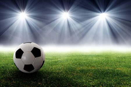 Soccer ball on the field of stadiumの写真素材