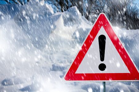 Warning traffic sign on a roadの写真素材