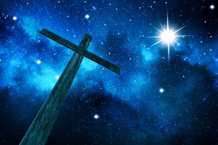 Cross and beautiful night skyの写真素材