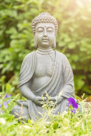Buddha statue in a parkの写真素材