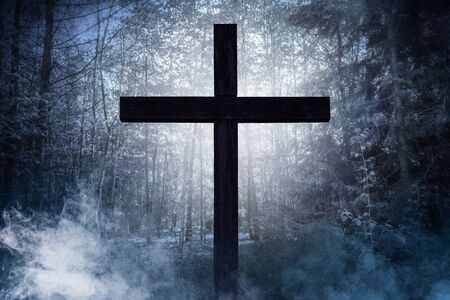 Holy cross on a foggy nightの写真素材