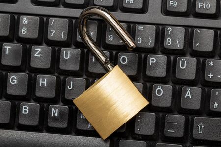 Unlocked Padlock On The Computer Keyboardの写真素材