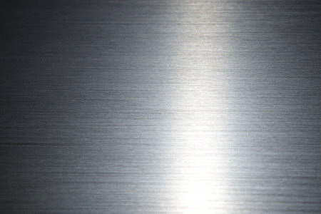 Metal background or texture of brushed steel plate with reflections Iron plate and shiny. non-edited...
