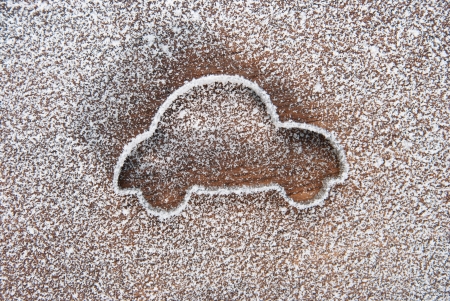 Cutter in the shape of car taken with a snowy background.の写真素材