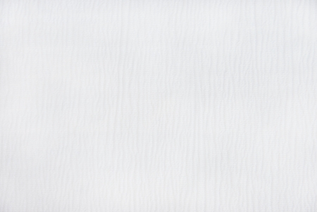 white quilted fabric photo shoot as backgroundの写真素材
