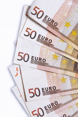 Fifty euro banknotes on the table on a white background.の写真素材
