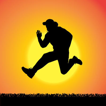 silhouette of man who jump at sunset.のイラスト素材