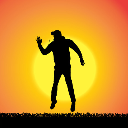 silhouette of man who jump at sunset.のイラスト素材