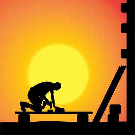 silhouette of a man working with tools at sunset.のイラスト素材