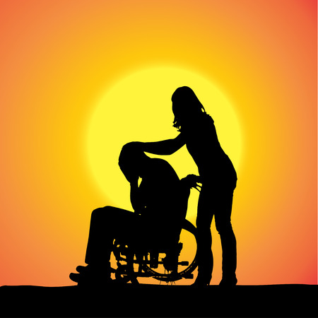 silhouettes of people in a wheelchair at sunset. のイラスト素材
