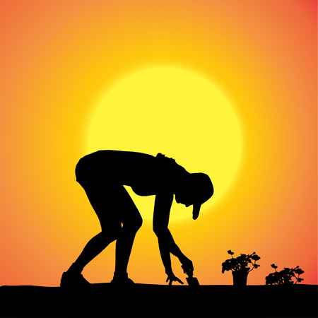 Vector silhouette of a gardener in the garden at sunset.のイラスト素材