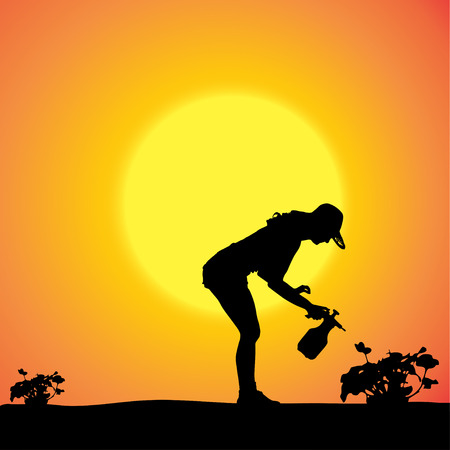 Vector silhouette of a gardener in the garden at sunset.のイラスト素材
