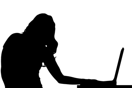 Vector silhouette of a woman who is sitting at the computer.のイラスト素材