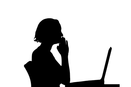 Vector silhouette of a woman who is sitting at the computer.のイラスト素材