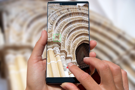 Woman with mobile phone photos christian church.の写真素材