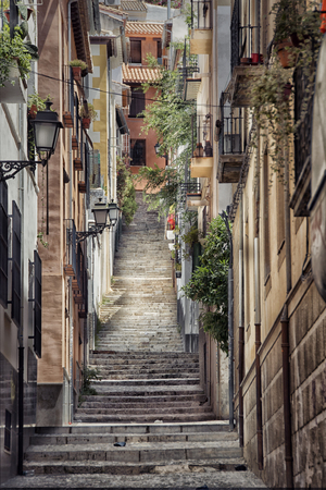 Old street with stairs in Granada in Spain.の写真素材