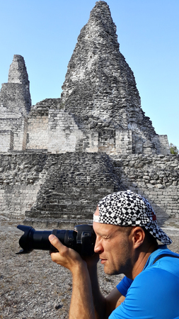 Photographer taking pictures of the piramid ruins in Mexico.の写真素材