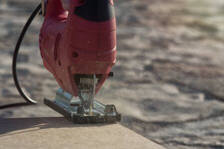 Detail jigsaw while working with flying chips.の写真素材