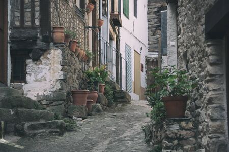 Street of old mediterranean town with stone houses and flowers. Galicia Spain.の写真素材