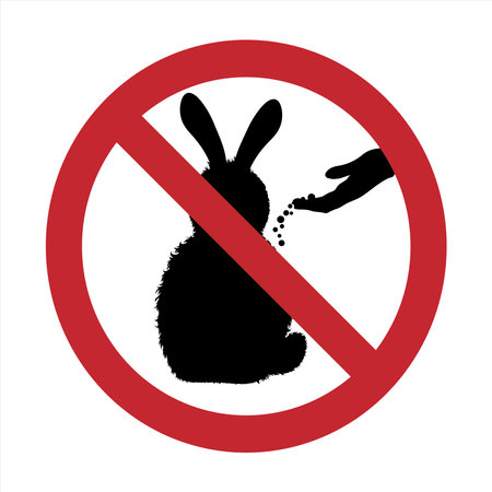 Vector silhouette of do not feeding rabbit mark on white background. Symbol of prohibition with animal.のイラスト素材