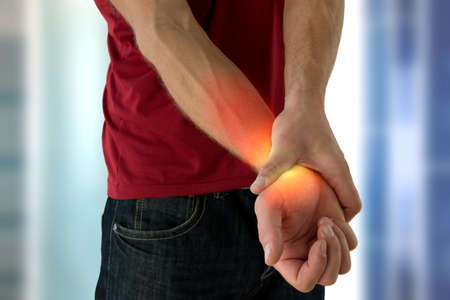Health problem concept of man suffering from hand pain.の写真素材