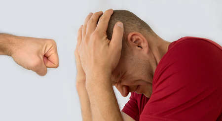 Man trying to protect himself with his arms blocking the atack.の写真素材