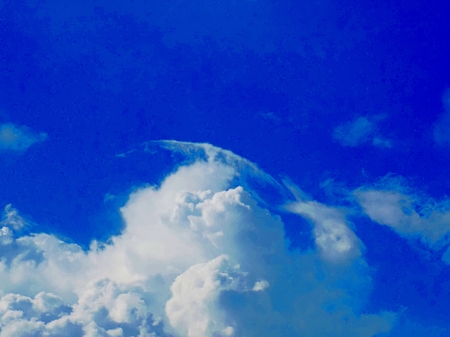 Cumulonimbus cloud during heat summer day indicating storm formation in unstable air mass (atmosphere) before cold front arrivalの写真素材