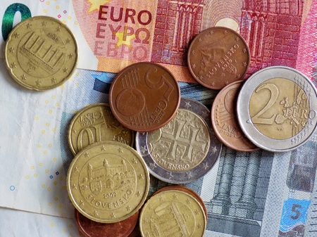 Euro coins on euro banknote